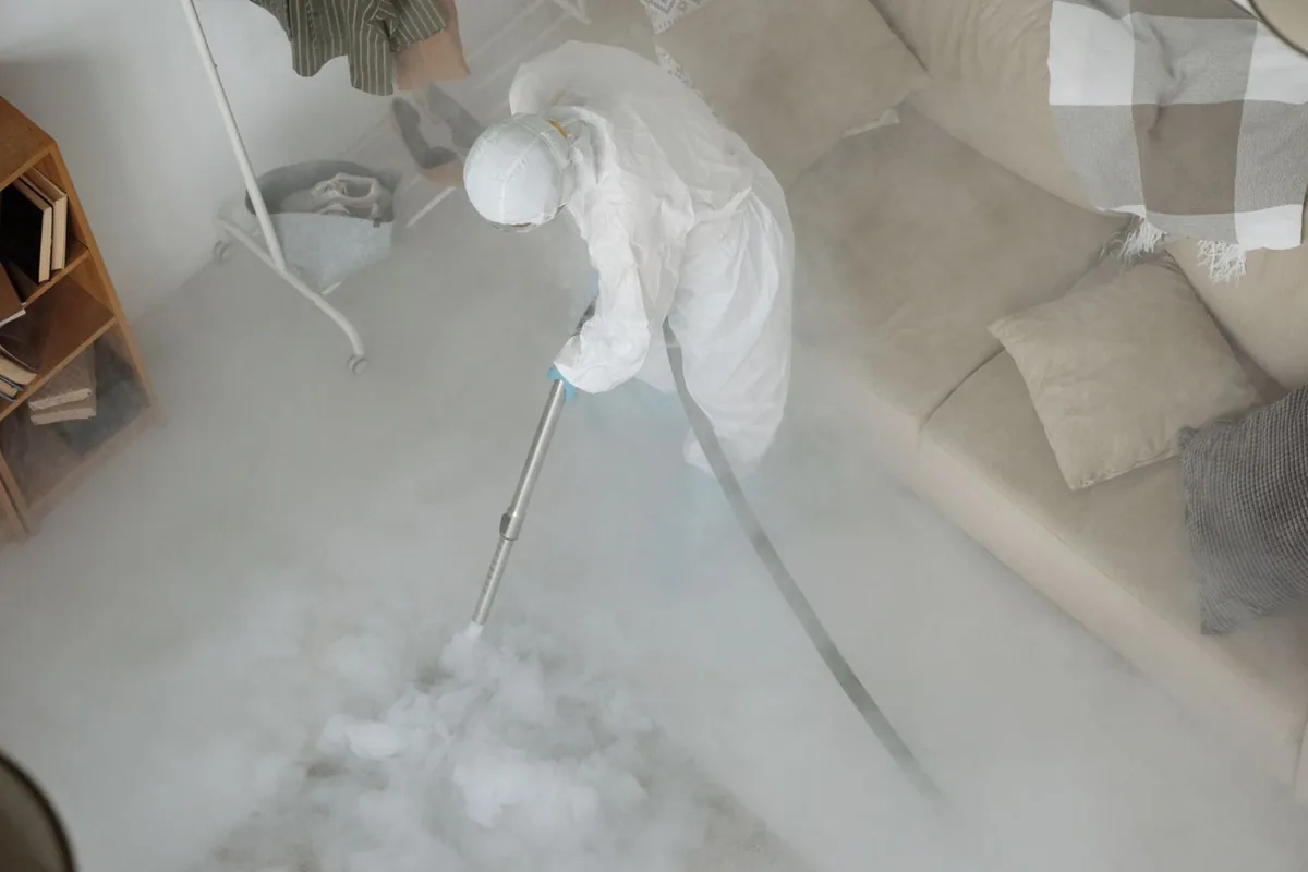 Biohazard cleanup technician in protective equipment, Webster County unified government, GA